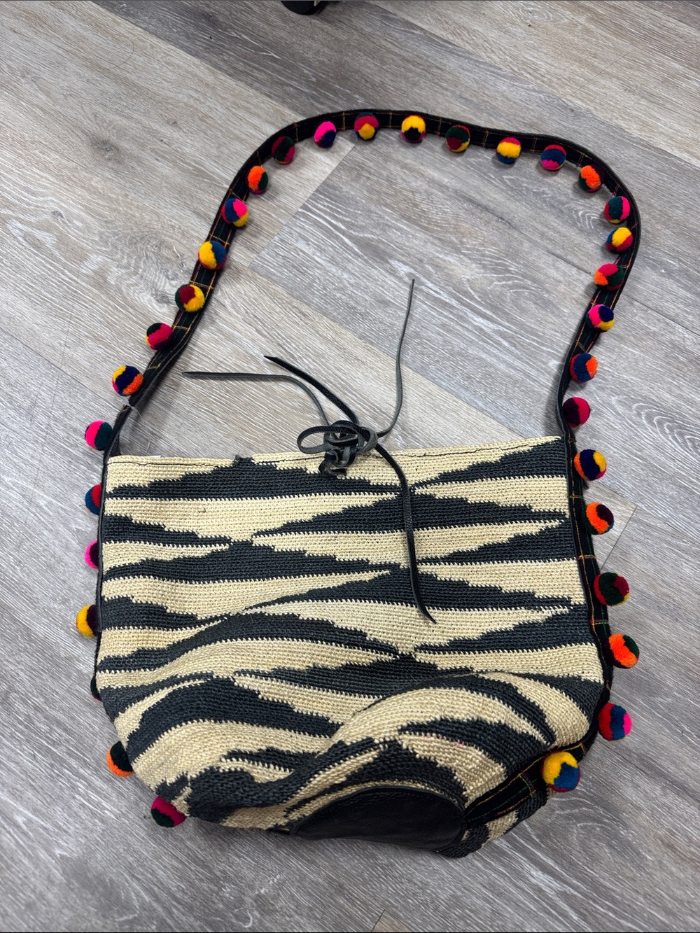 Zebra-Print Sensi Studio Crochet Shoulder Bag with Colorful Pom Pom Strap